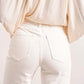 Cindy wijd uitlopende jeansbroek wit detail achterkant